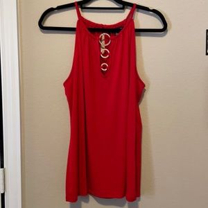 Red INC top with gold and diamond accents.